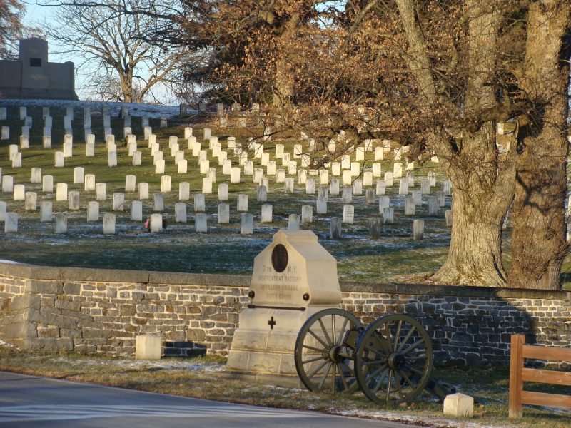 The Lincoln Address Memorial (top left) in the Gettysburg National Cemetery. The 2 small flanking markers for the 3rd NY Artillery monument (foreground) indicate the breadth of the unit's position. By Sallicio -
 CC BY-SA 3.0