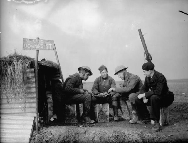 Army and French Air Force personnel outside a dugout named '10 Downing Street' on the edge of an airfield, 28 November 1939 (© IWM (O 344)