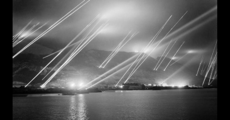 Searchlights in the night sky during air-raid practice on Gibraltar, 20 November 1942.