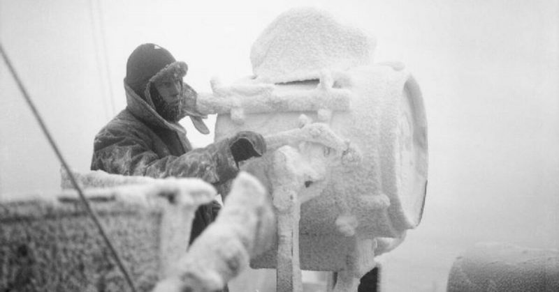 Frozen: Ice forms on a 20-inch signal projector on the cruiser HMS Sheffield during an Arctic Convoy mission. Churchill called it 'the worst journey in the world.' 