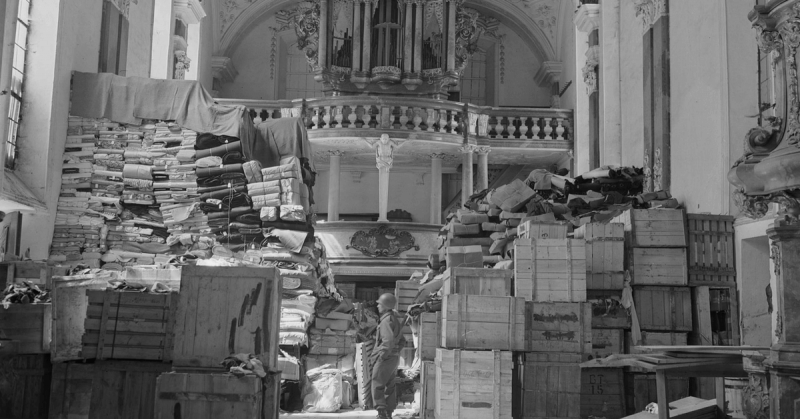 A United States Soldier from the US Third Army guards stacks of recovered Nazi loot in Bavaria in 1945. It was hoped that the fabled train might contain many pieces of art and treasure which have remained missing since WW2. 