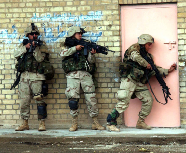 Soldiers from 1st Platoon, Apache Troop, 2-5 Cav, 2nd BCT, 1st Cav Div move tactically as they enter and clear their objective during combat operation in Fallujah on the 9th of Nov 2004 during Operation Iraqi Freedom. Photo by SFC Johancharles Van Boers, 55th Signal Company, Combat Camera, Fort Meade, Maryland. Release for Public Use