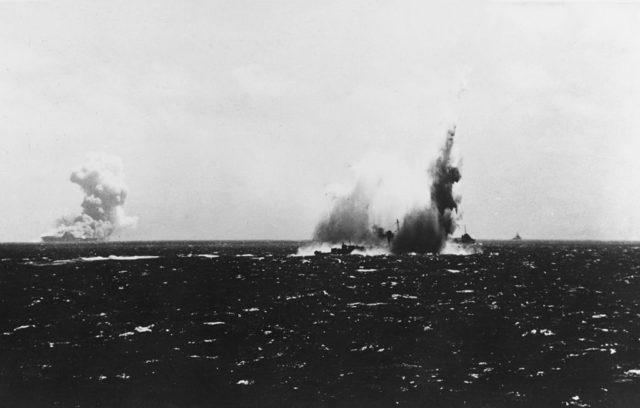 The USS O'Brian hit with the Wasp burning (at left) Image Source: Official U.S. Navy photo 80-G-457818 from the U.S. Navy Naval History and Heritage Command