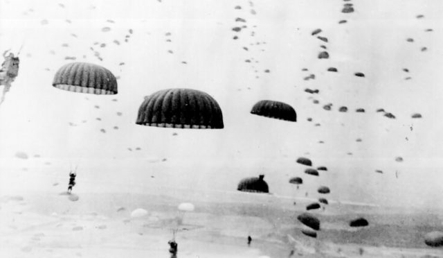 Parachutes open overhead as waves of paratroops land in Holland during operations by the 1st Allied Airborne Army. September 1944. Wikipedia / Public Domain