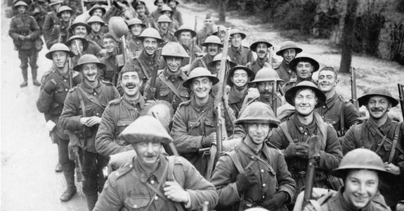 The 10th Battalion, the Royal Fusiliers, known as the 'Stockbrokers' Battalion', smiling as they march to the trenches.