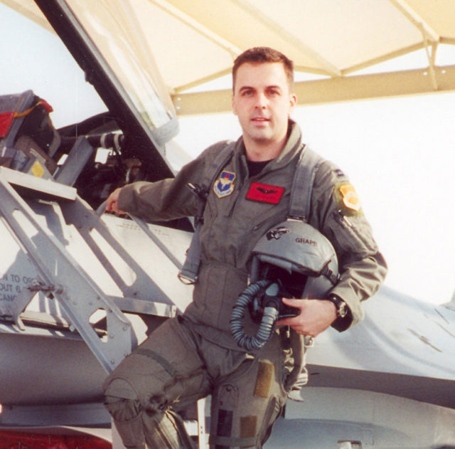 Major Troy Gilbert stands on the ladder of an F-16 at Luke Air Force Base, Ariz. Gilbert, an F-16 Fighting Falcon pilot, was killed Nov. 27, 2006, in an F-16 crash 30 miles southwest of Balad Air Base, Iraq. Gilbert was the standardization and evaluation chief for the 332nd Expeditionary Operations Group and was deployed from the 309th Fighter Squadron from Luke Air Force Base, Ariz. (Courtesy photo/Gilbert family)