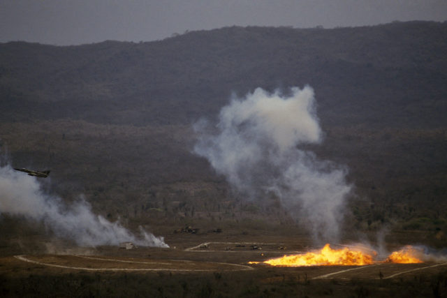 An Ecuadorian Air Force IAI Kfir airplane drops napalm on a target during Dominic "Blue Horizon", a US-Ecuador joint military exercise.