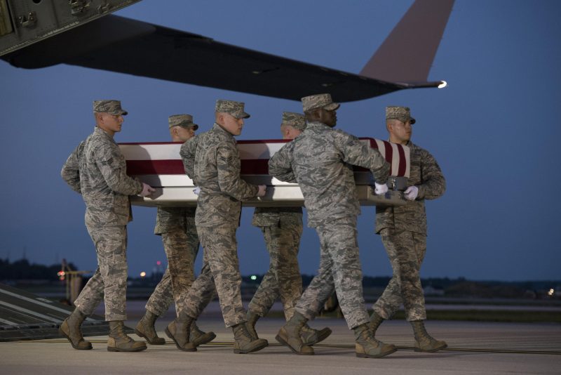 An Air Force carry team carries the remains of Maj. Troy Gilbert Oct. 3, 2016, at Dover Air Force Base, Delaware.