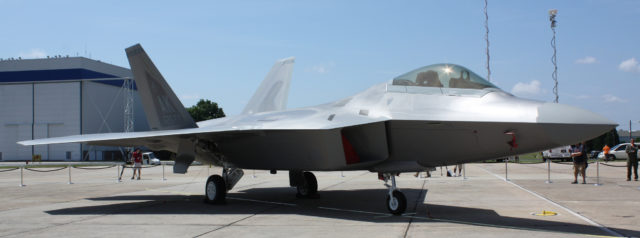 An F-22 Raptor sits on the tarmac