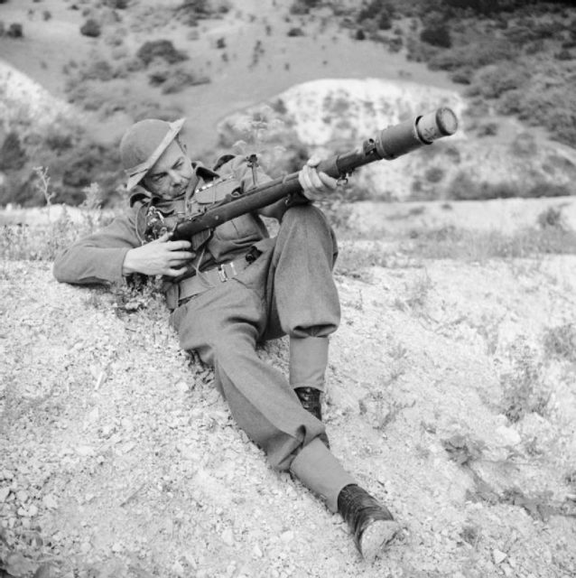A member of the British Home Guard demonstrates a rifle equipped to fire an No. 68 anti-tank grenade.