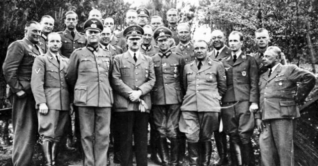 Hitler with his staff. Morell is the fourth starting right. By Bundesarchiv – CC BY-SA 3.0 de