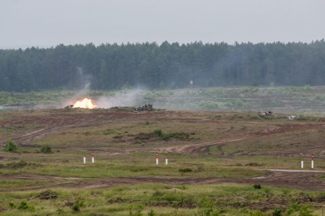 An M1A2 SEP V2 Abrams Main Battle Tank (MBT) from 1st Brigade Combat Team, 3rd Infantry Division, fires 120mm rounds. Photo: Sgt. 1st Class John Fries.