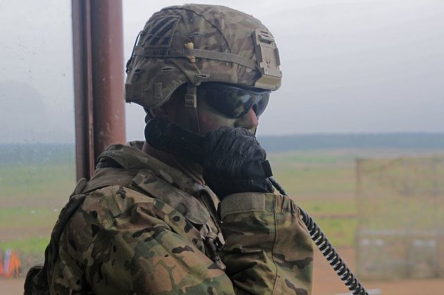 SSG Rene Madsen, Battalion Master Gunner, 2/7 Infantry Regiment, 1st Brigade Combat Team, 3rd Infantry Division communicates to firing units over a tactical radio. Photo: Sgt. 1st Class John Fries.