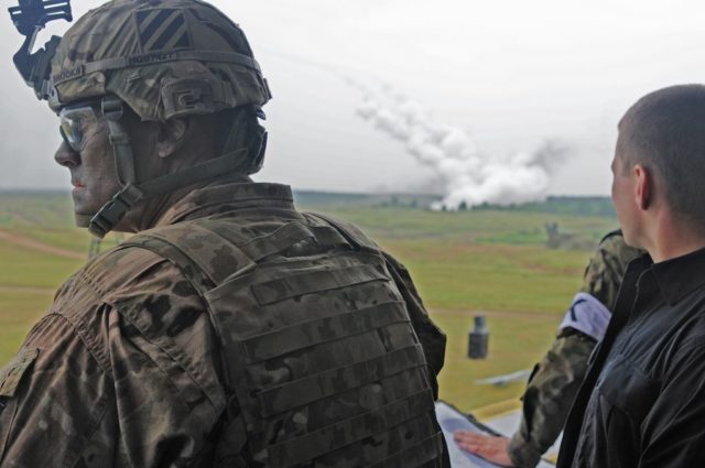 Col. Phil Brooks observes a live-fire demonstration from an observation deck as two High Mobility Artillery Rocket System (HIMARS) are fired during Exercise Anakonda 2016. Photo: Sgt. 1st Class John Fries.