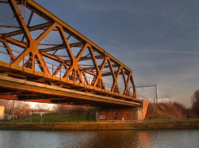 The Nimy railroad bridge. Godley, Dease, and the machine gun section defended the south embankment (shown). Image Source: