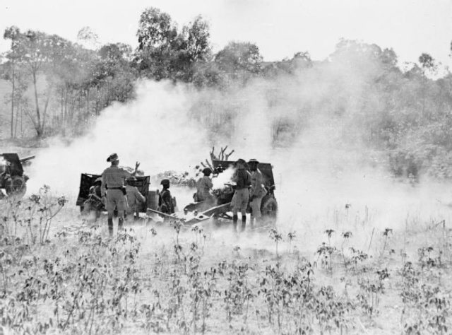 Kings African Rifles' 25 pdr battery in action against Vichy positions near Ambositra.
