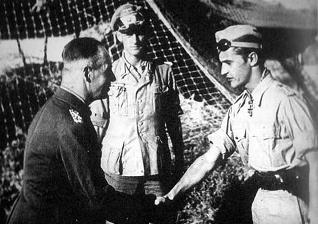 General Field Marshall Johannes Erwin Eugen Rommel (left), "The Desert Fox," congratulating Marseille for being the youngest to attain the rank of "Hauptmann" on September 16, 1942