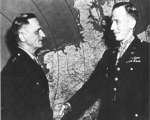 Howard (left) receiving the Medal of Honor from Lieutenant General Carl Spaatz on June 5, 1944