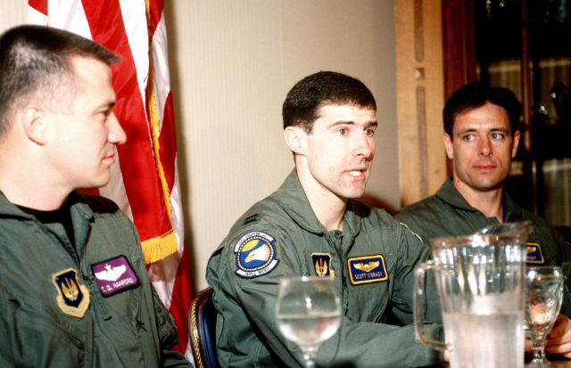 O'Grady (center) at a press conference after his rescue, with Captains Hanford (left) and Wright Photo Credit