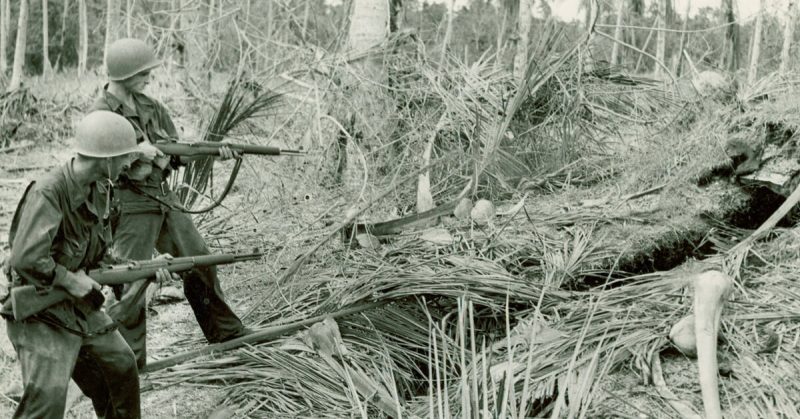 American Soldiers clearing a Japanese bunker near Buna, New Guinea. 