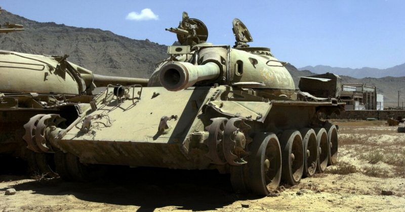 An Old Soviet T55 tank left by the Soviet army during their withdrawal lies rusting in a field near Bagram Air Base. 