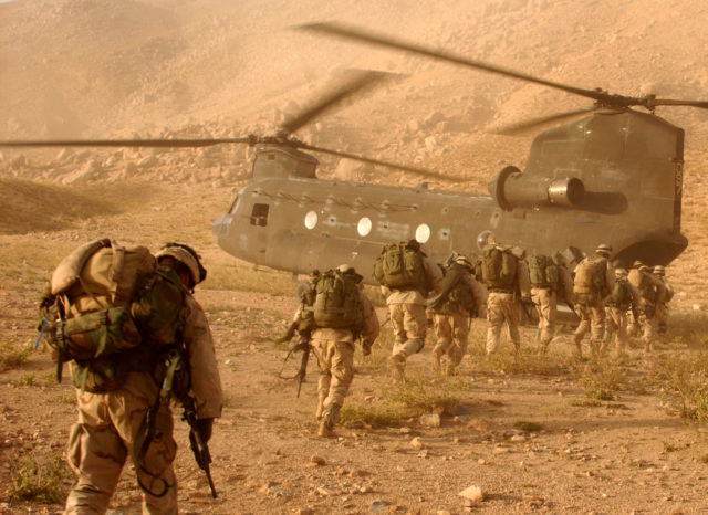 American troops boarding a helicopter in Afghanistan