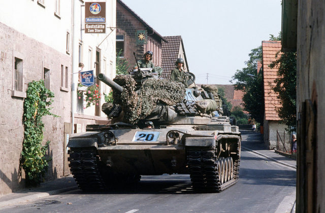 M60A1 tank of the U.S. Army maneuvers through a narrow German village street while participating in the multi-national military training exercise, REFORGER '82. Photo Source