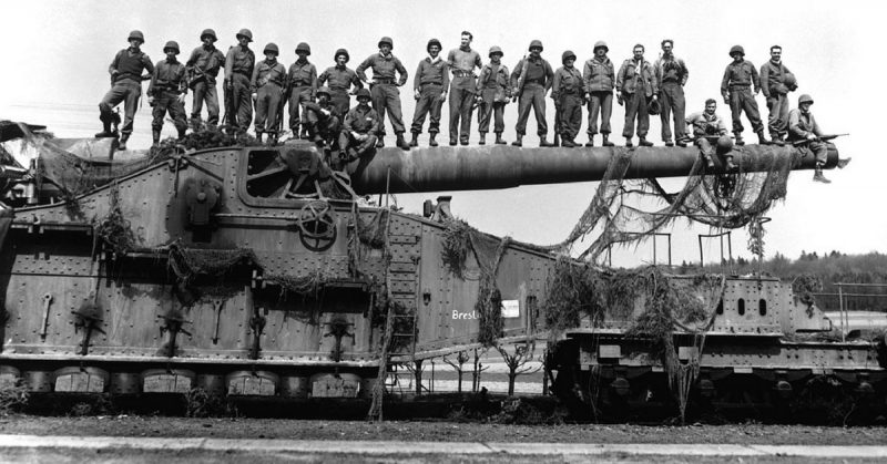 Mammoth 274-mm railroad gun Captured in the U.S. Seventh Army advance near Rentwertshausen easily holds these 22 men lined up on the barrel. Although it's from an 1887 French design, the gun packs a powerful wallop. April 10, 1945.