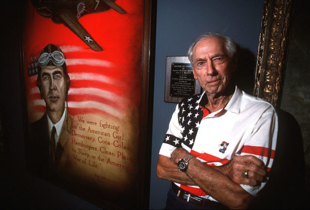 Scott with an oil painting of himself at the Museum of Aviation in Georgia (1994)