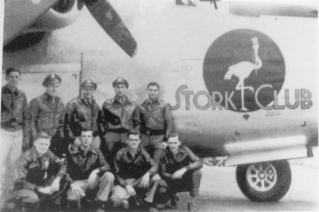 Lt. Joseph Chiminiello, (kneeling second r-l) explains that to be a good lower ball turret gunner in a B-17 or B-24, "the trick was to keep moving the turret. Keep moving it all around so they'd know you weren't asleep."