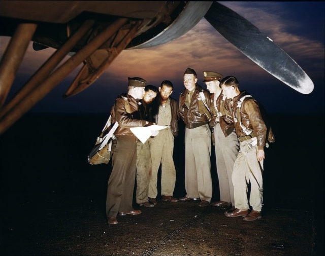 1938. A combat crew receives final instructions just before taking off in a mighty YB-17 bomber from a bombardment squadron base at the field, Langley Field, Va.