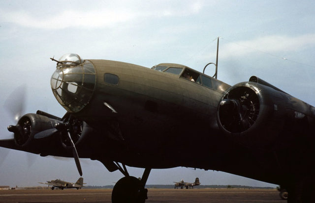 1938. A giant of the skyways poises for flight, Langley Field, Va. The four powerful engines of a YB-17 bomber are warmed up before a takeoff.