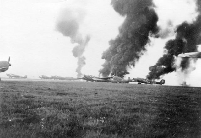 German planes ablaze during the invasion of the Netherlands. Photo Credit 