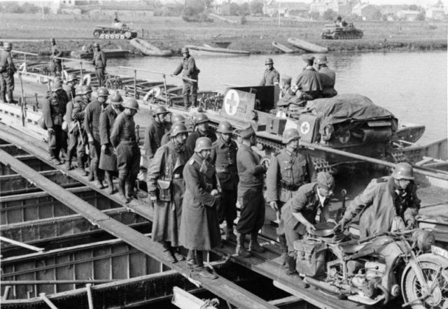1st Panzer Division crossing a pontoon bridge on the Meuse near Sedan, 1940. Photo Source 