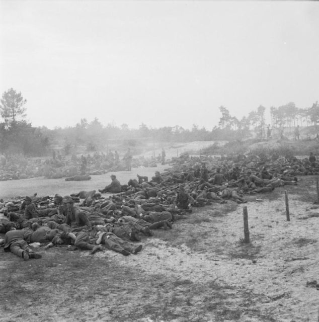 German prisoners wait to be moved to the rear, at Eindhoven. Image Source: Wikimedia Commons/ public domain