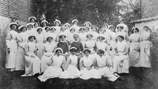 Cavell (seated center) with her student nurses in Brussels Photo Credit