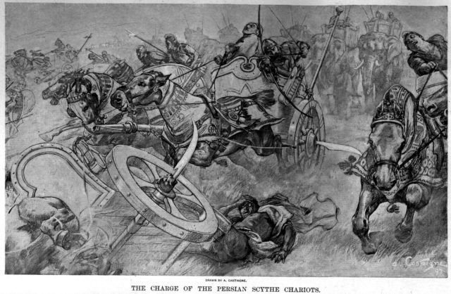 the_charge_of_the_persian_scythed_chariots_at_the_battle_of_gaugamela_by_andre_castaigne_1898-1899