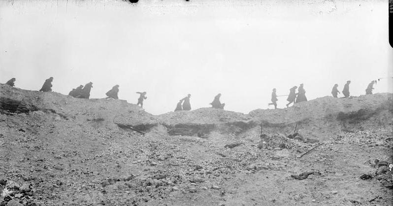 British troops running along the lip of the Lochnagar mine crater at La Boisselle, France