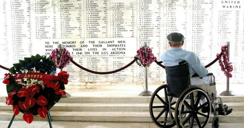 Pearl Harbor survivor Bill Johnson reads the list of names inscribed in the USS Arizona Memorial.