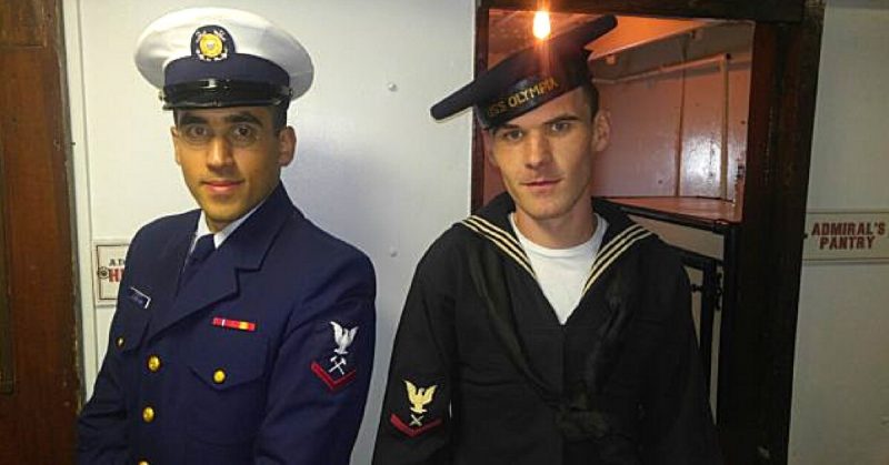 A Coast Guard Damage Controlman and a Gunner's Mate from the Cruiser Olympia Living History Crew stand in front of Admiral Dewey's Pantry and stores on board USS Olympia at the Independence Seaport Museum, during Veteran's day celebration. 11/11/2016