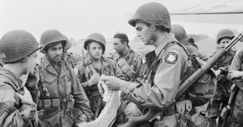 American Paratroopers receive a last minute briefing before boarding the planes. 