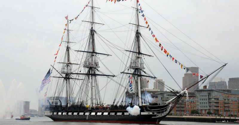 USS Constitution fires a 17-gun salute near U.S. Coast Guard Base Boston during the ship's Independence Day underway demonstration in Boston Harbor 2014.