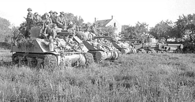 Two M4 Sherman tanks, a Sherman Firefly, and a Sherman Crab on July 18, 1944, preparing to launch Operation Goodwood