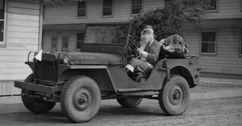 US Army soldier dressed as Santa Claus during the Christmas holiday season during WWII.
