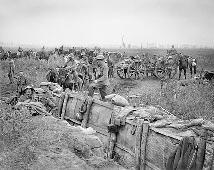 The Battle of Pilckem Ridge : A British 18 pounder field gun battery taking up new positions close to a communication trench near Boesinghe, 31 July 1917. Photo Credit