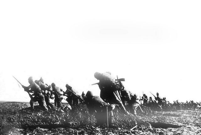 Turkish troops leaving their trench in an attack.