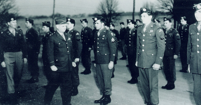 The OSS was conducting multiple activities and missions. General William J. Donovan reviews Operational Group members prior to their departure for China in 1945.