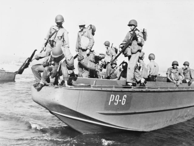 Men disembark an LCP(L) in 1942. Climbing over the side was not only awkward, but also made the infantry a better target for the enemy. 