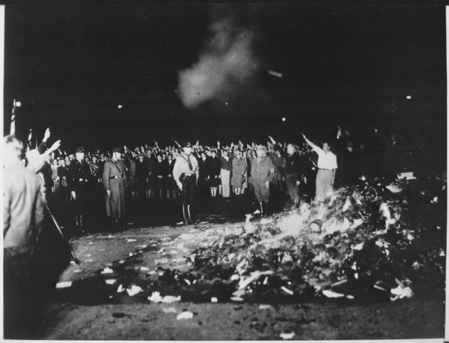 A Nazi book burning to promote censorship.