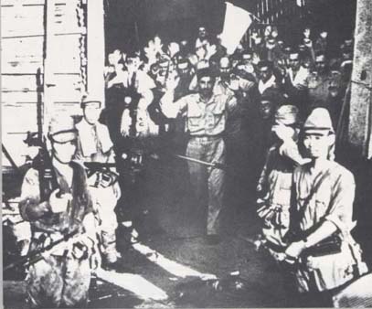 The final surrender of the Malinta tunnels. American troops had holed up the tunnel system beneath Malinta Hill, and held out until the very end. 